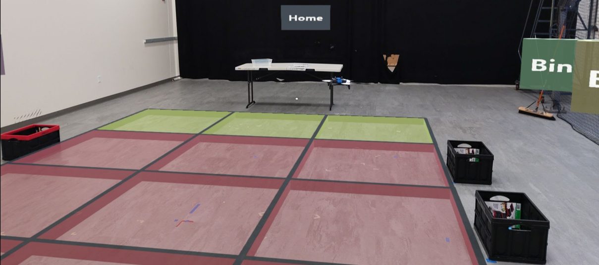 The color-keyed AR floor grid marks safe and forbidden regions.